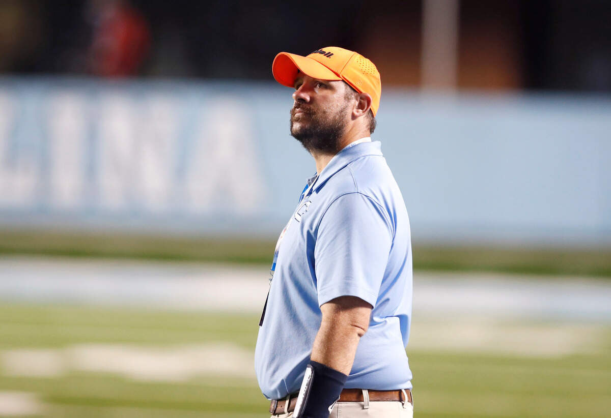 Cleveland head coach Scott Riley looks up at the scoreboard in the final seconds of Mt. Tabor High School’s 24-16 victory over Cleveland High School in the NCHSAA 3AA title game at Kenan Stadium in Chapel Hill, N.C., Thursday, May 6, 2021.