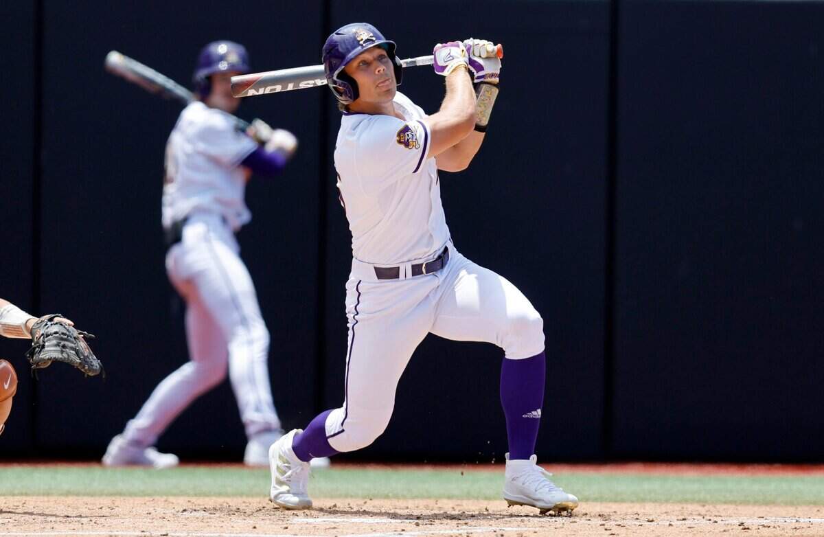 East Carolina’s Bryson Worrell (35) hits a single to load up the bases in the first inning during ECUs game against Texas in the Greenville Super Regional at Clark-LeClair Stadium Friday, June 10, 2022.