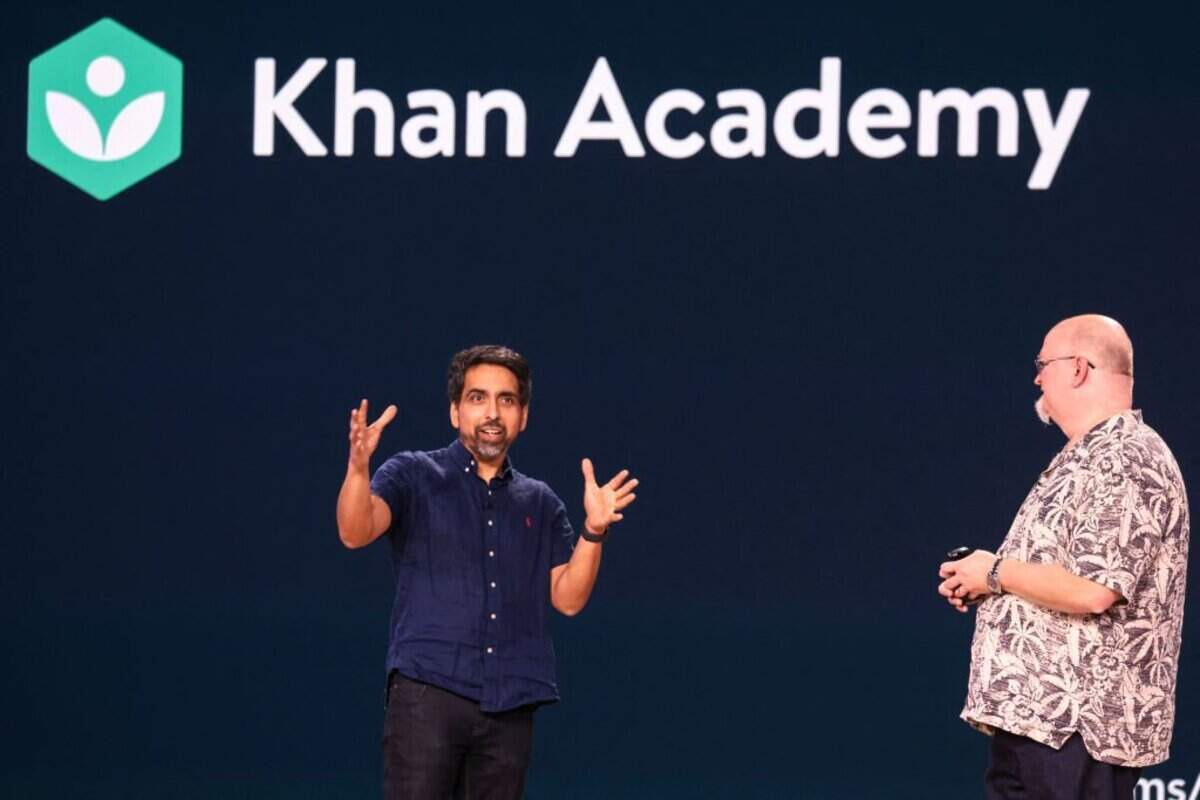 Khan Academy CEO Sal Khan (L) and Microsoft Chief Technology Officer and Executive Vice President of Artificial Intelligence Kevin Scott speak at the Microsoft Briefing event at the Seattle Convention Center Summit Building in Seattle, Washington, on May 21, 2024. (Photo by Jason Redmond / AFP) (Photo by JASON REDMOND/AFP via Getty Images)