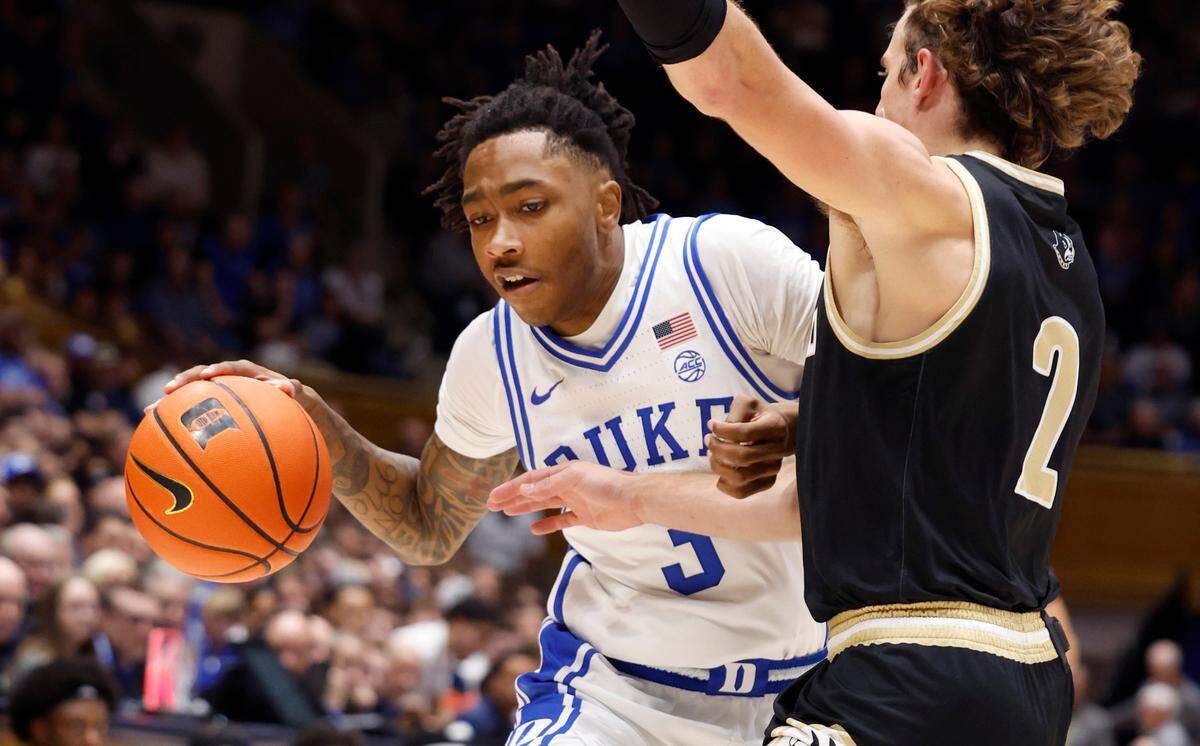 Duke’s Isaiah Evans (3) drives by Wofford’s Dillon Bailey (2) during the first half of Duke’s game against Wofford at Cameron Indoor Stadium in Durham, N.C., Saturday, Nov. 16, 2024.