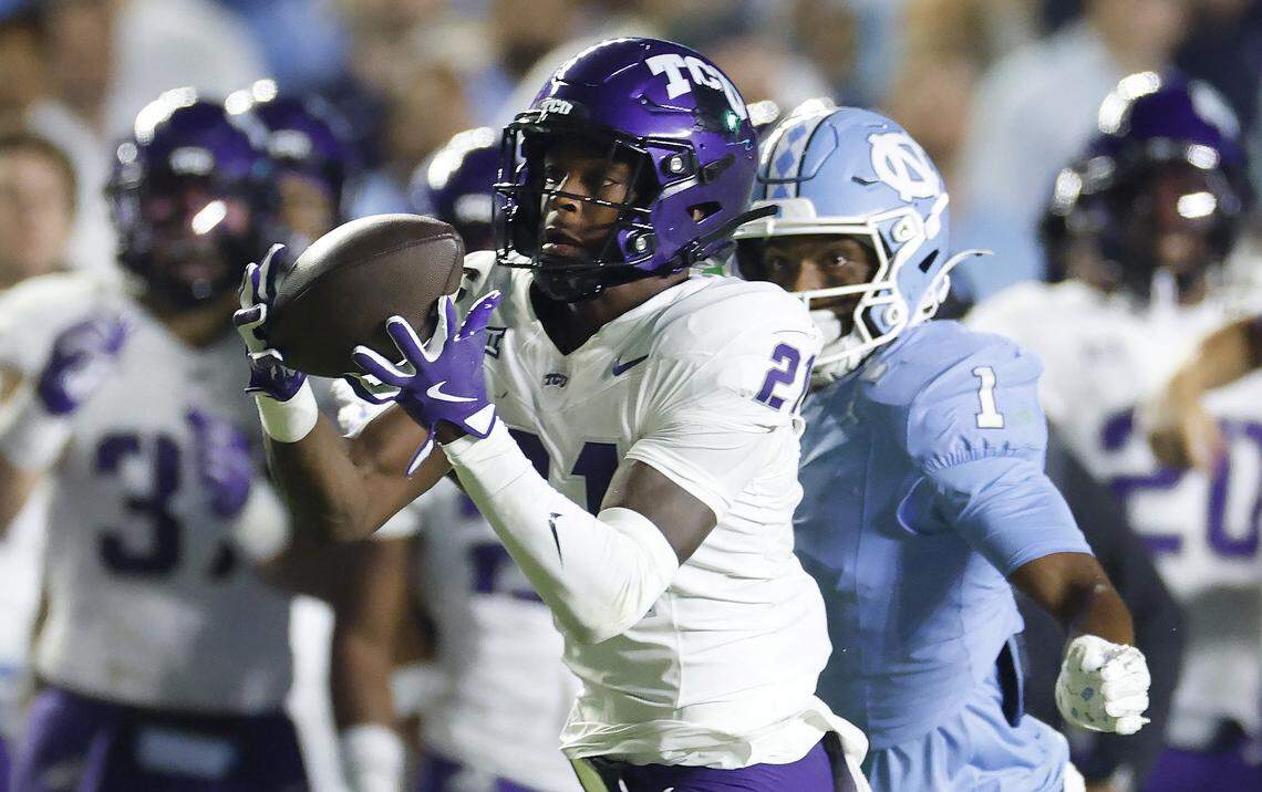 TCU safety Bud Clark (21) intercepts the ball intended for North Carolina wide receiver Jordan Shipp (1) during the first half of UNC’s game against TCU at Kenan Stadium in Chapel Hill, N.C., Monday, Sept. 1, 2025. Clark returned the ball for a touchdown.