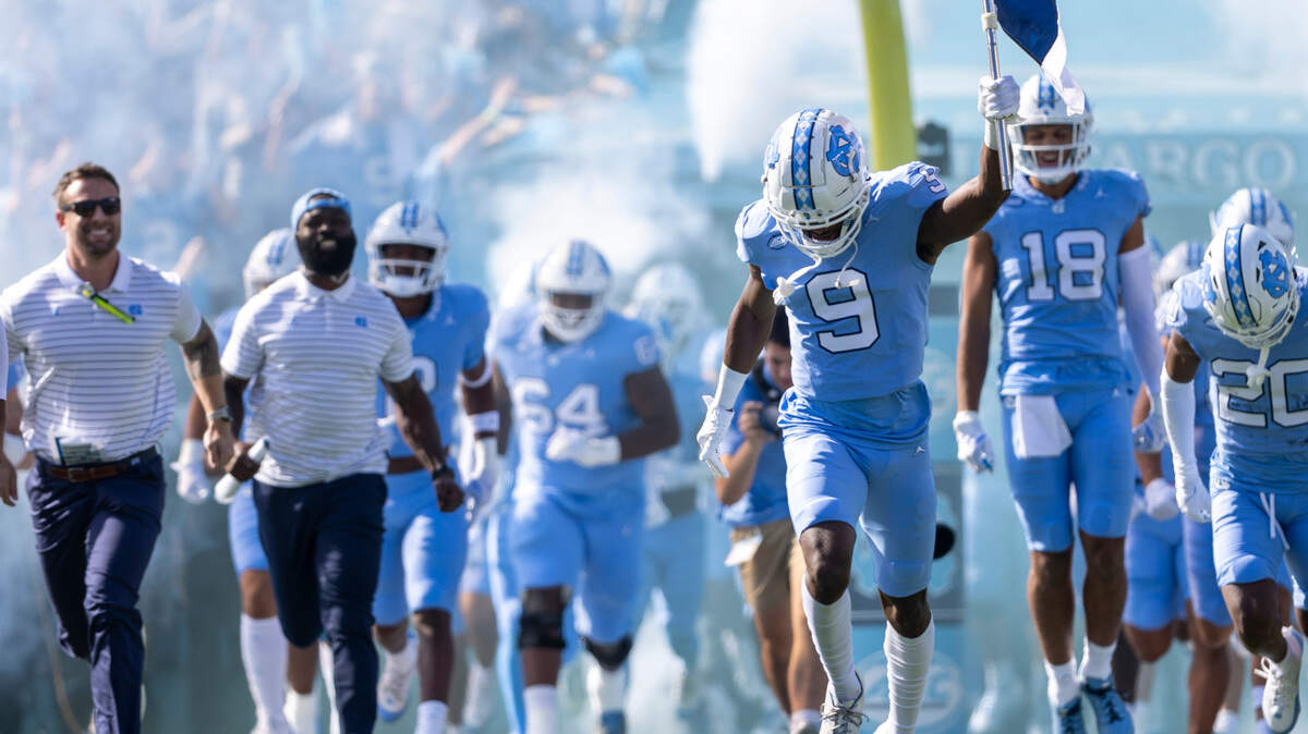 North Carolina wide receiver Devontez Walker (9) leads the team into Kenan Stadium for their game against Syracuse on Saturday, October 7, 2023 at Kenan Stadium in Chapel Hill, N.C. Walker was granted eligibility this week by the NCAA to play in his first game of the 2023 season for the Tar Heels.
