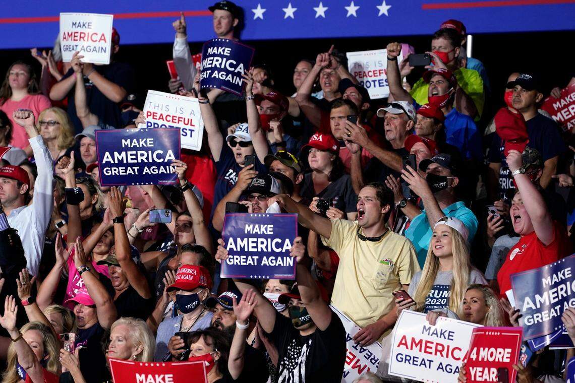 Supporters cheer as President Donald Trump speaks during a campaign rally at Smith Reynolds Airport, Tuesday, Sept. 8, 2020, in Winston-Salem, N.C. 