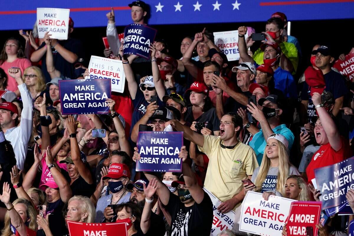 Supporters cheer as President Donald Trump speaks during a campaign rally at Smith Reynolds Airport, Tuesday, Sept. 8, 2020, in Winston-Salem, N.C.