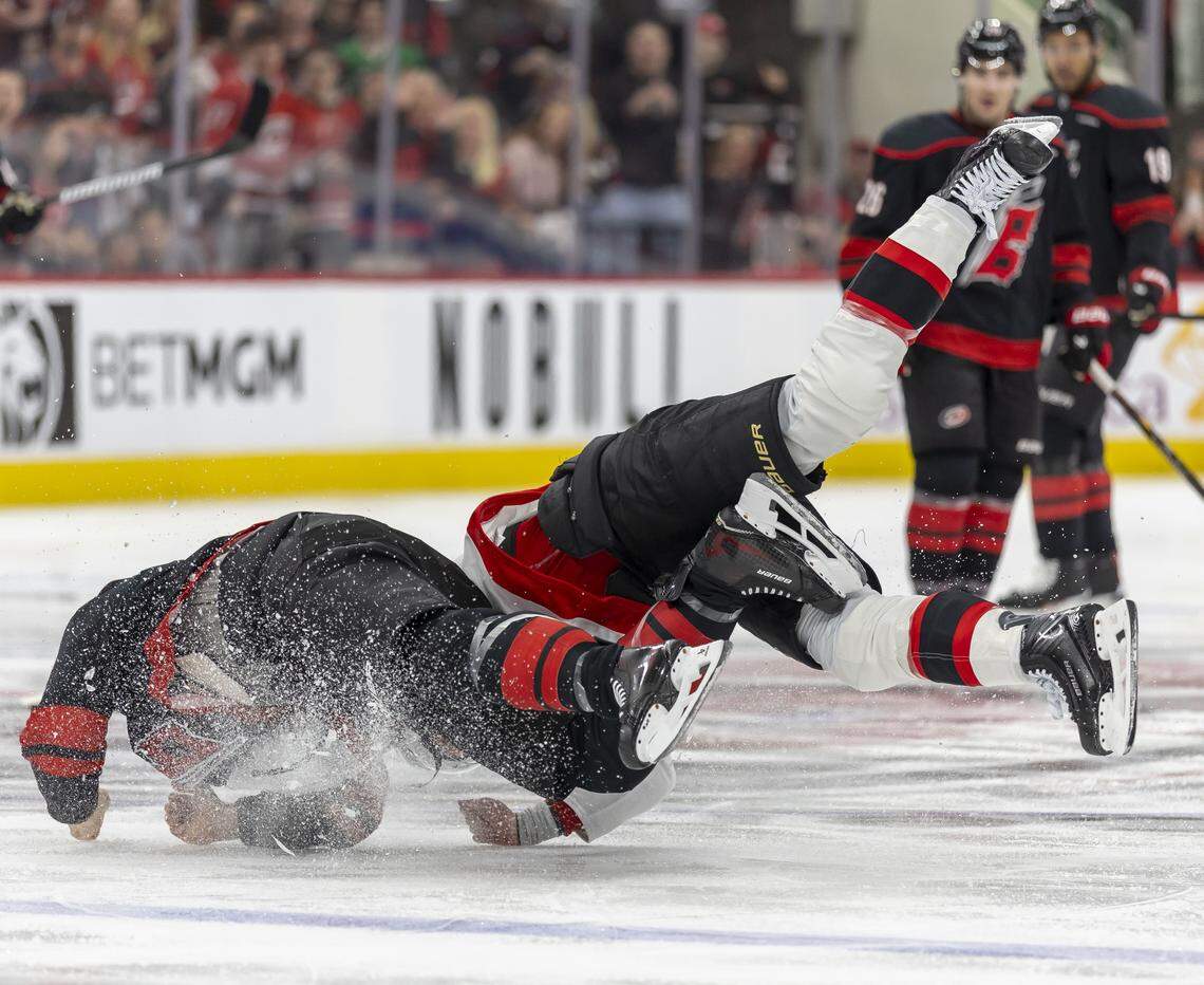Ottawa left wing Brady Tkachuk and Carolina Hurricanes center Jordan Staal (11) tumble to the ice during a fight in the first period on Saturday, April 18, 2026 during the first round of the Stanley Cup Playoffs at Lenovo Center in Raleigh, N.C. 
