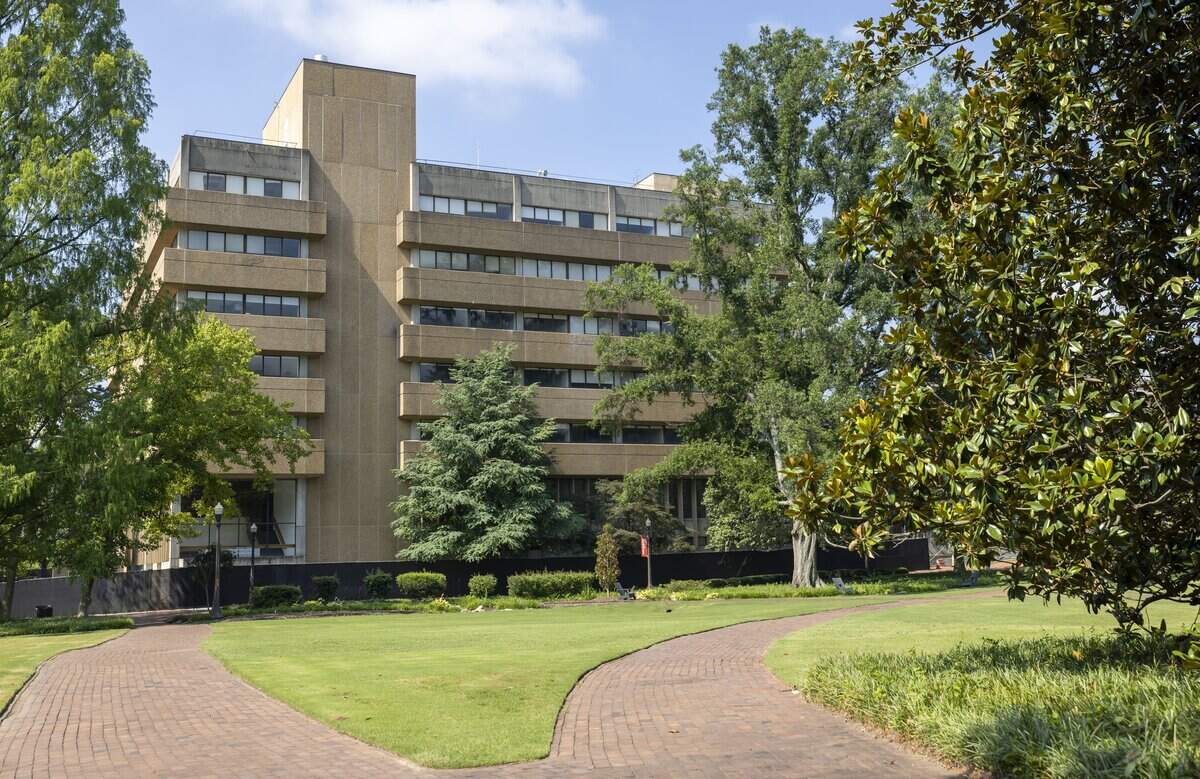 Fencing surrounds Poe Hall on the N.C. State campus on Wednesday, July 8, 2026 in Raleigh, N.C. The structure was closed in 203 after high levels of PCB's, toxic chemicals that have been linked to health issues including cancer are found in the building.