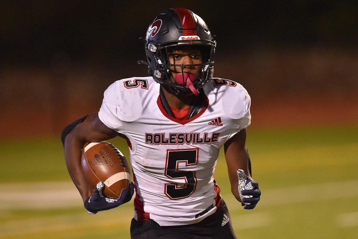 Rolesville’s Noah Rogers (5) runs for yardage after the kickoff during the first half. The Cardinal Gibbons Crusaders and the Rolesville Rams met in the NCHSAA 4A East Regional Final in Raleigh, N.C. on December 3, 2021