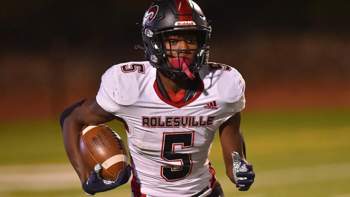 Rolesville’s Noah Rogers (5) runs for yardage after the kickoff during the first half. The Cardinal Gibbons Crusaders and the Rolesville Rams met in the NCHSAA 4A East Regional Final in Raleigh, N.C. on December 3, 2021