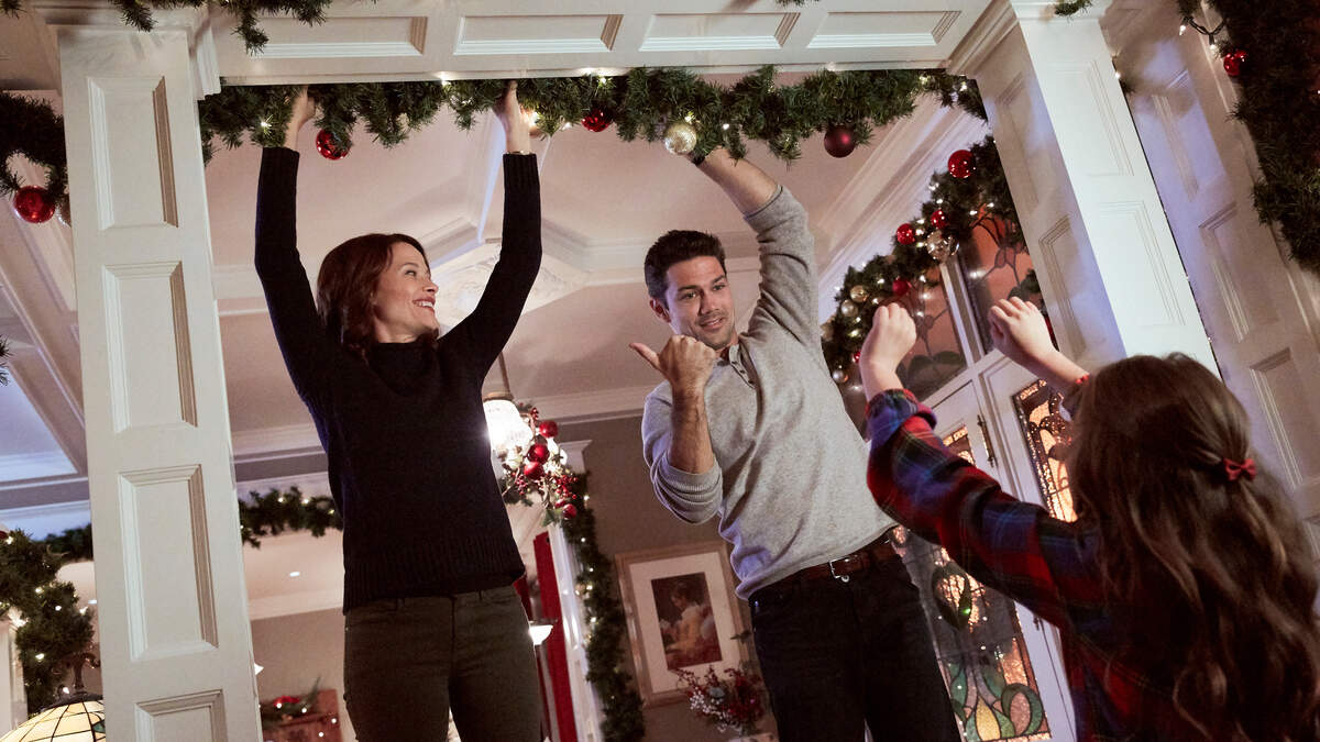 Scottie Thompson,left, and Ryan Paevey in the Hallmark Movies & Mystery movie “Hope at Christmas.”