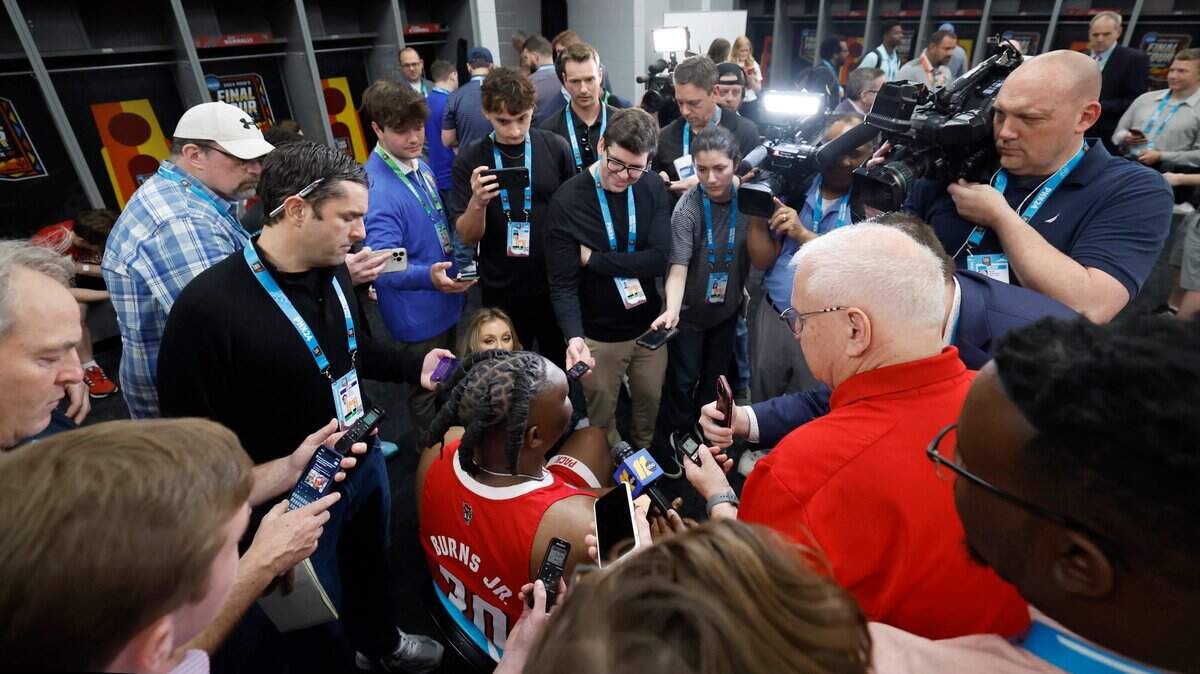 N.C. State’s DJ Burns Jr. is surrounded by the media during an availability in the N.C. State locker room at State Farm Stadium in Glendale, Ariz. Thursday, April 4, 2024. The Wolfpack will face Purdue in the Final Four on Saturday.