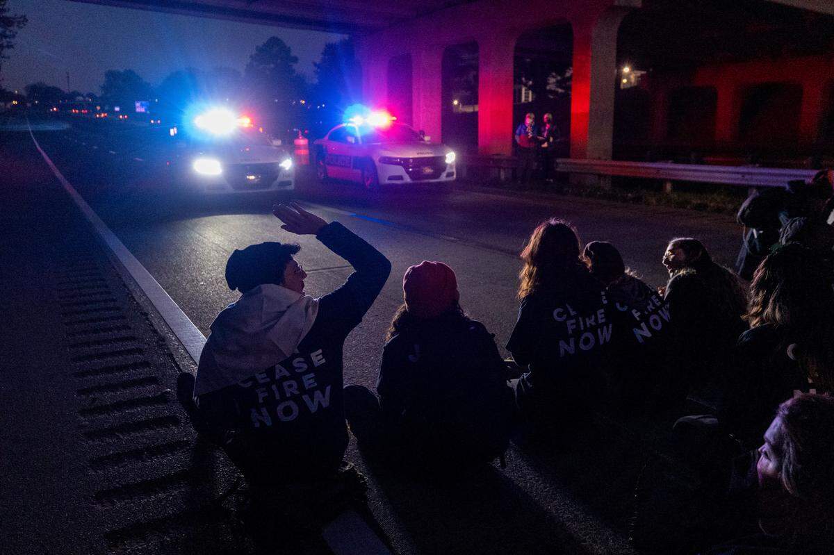 Protesters block the northbound lanes of the Durham Freeway at the South Magnum Street bridge for hours Thursday evening, Nov. 2, 2023 while demanding a ceasefire in the Israel-Gaza War as police warned of arrests.