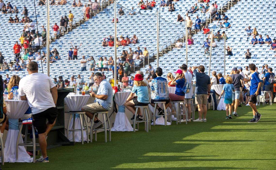 Soccer fans take their seats behind the goal in the Blue Zone of Kenan Stadium for the FC Series game between Chelsea and Wrexham on Wednesday, July 19, in Chapel Hill, N.C.