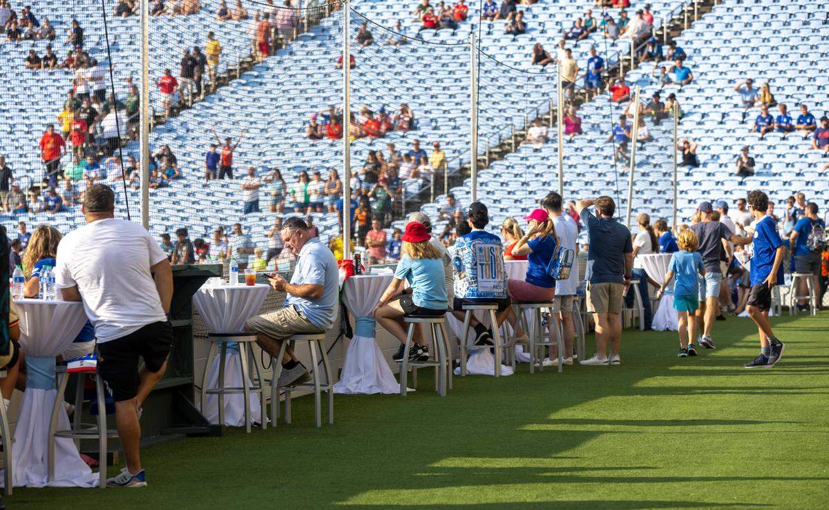 Soccer fans take their seats behind the goal in the Blue Zone of Kenan Stadium for the FC Series game between Chelsea and Wrexham on Wednesday, July 19, in Chapel Hill, N.C.