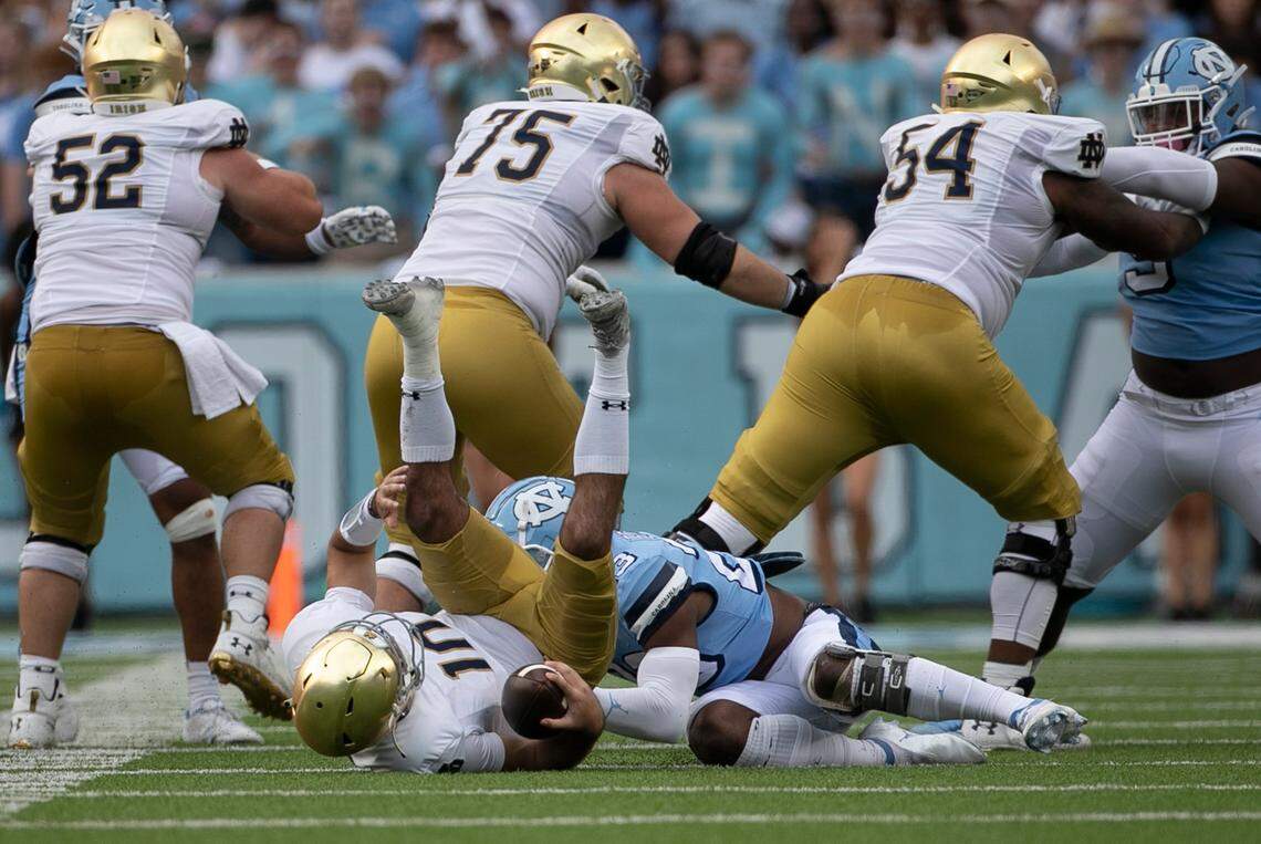 North Carolina’s Power Echols (23) sacks Notre Dame quarterback Drew Pyne (10) in the first quarter on Saturday, September 24, 2022 at Kenan Stadium in Chapel Hill, N.C.