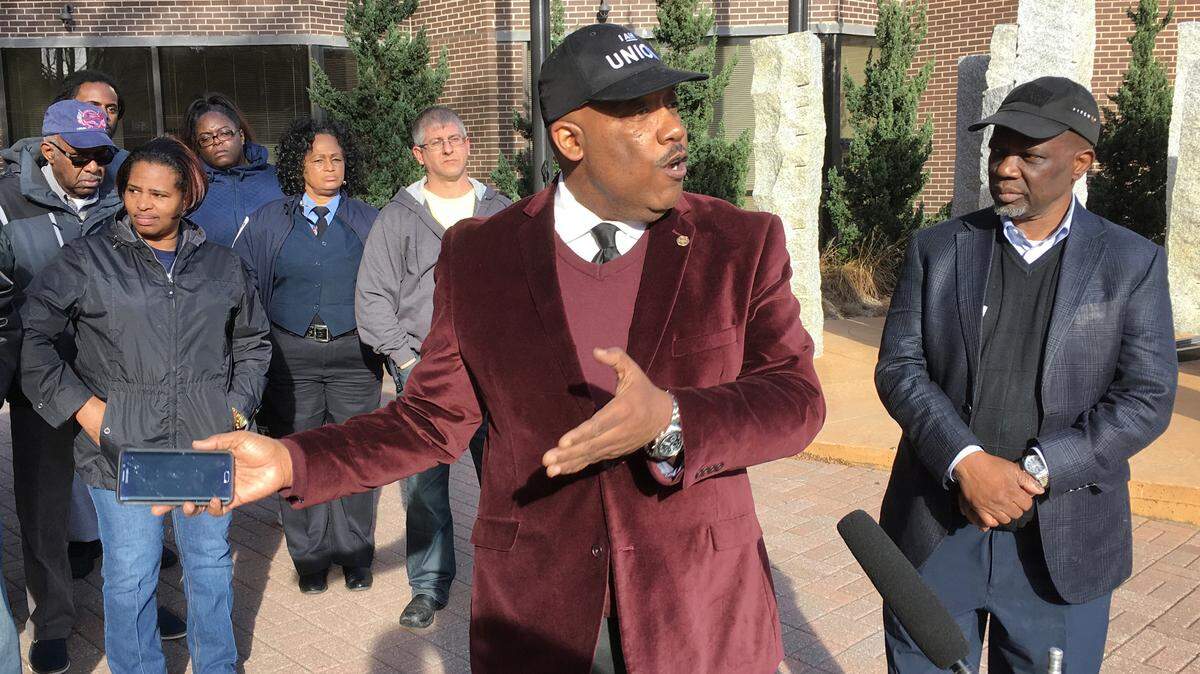 GoRaleigh bus driver Terrence Dewberry, president of Local 1328 of the Amalgamated Transit Union, speaks outside Raleigh city hall on Thursday, as other drivers look on. The drivers are upset over the way the recent expansion of the GoRaleigh system was handled.