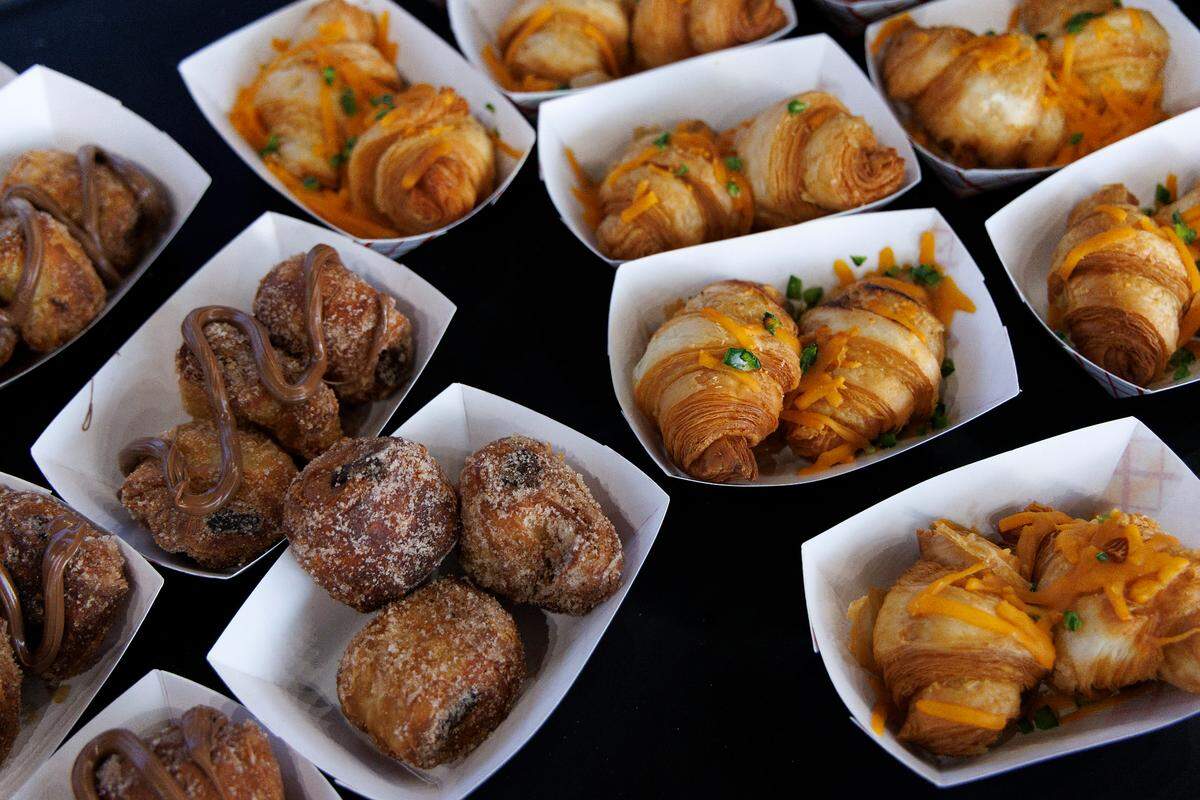 Fried Cheesy Croissants from LaFarm Bakery, right, one of the new foods available at the 2024 North Carolina State Fair, as seen on media day on Monday, Oct. 14, 2024, at Dorton Arena in Raleigh, N.C.