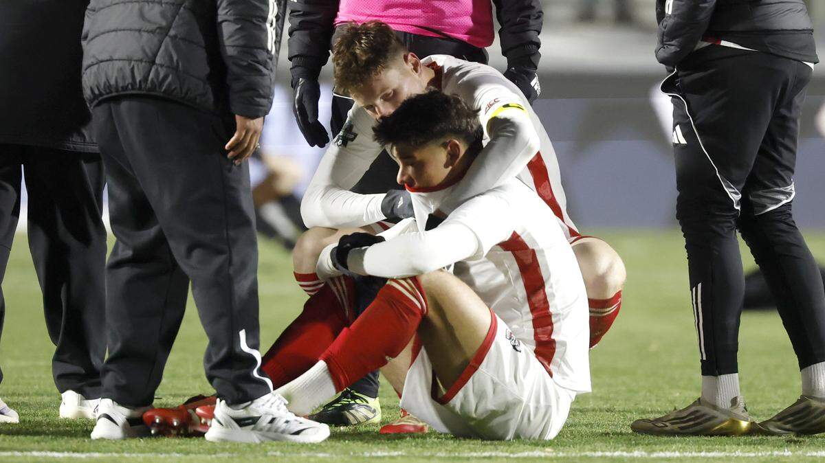 N.C. State's Nikola Markovic (6) consoles Justin McLean (8) after Washington’s 3-2 overtime victory over N.C. State in the 2025 Men’s Soccer National Championship at WakeMed Soccer Park in Cary, N.C., Monday, Dec. 15, 2025.