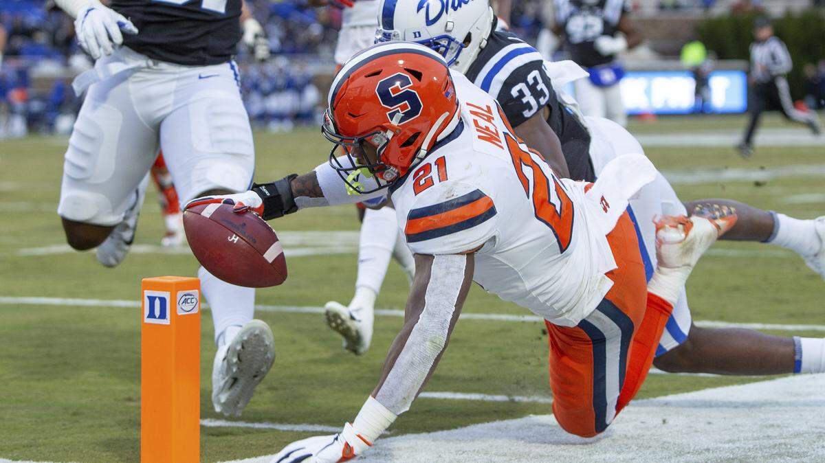 Syracuse’s Moe Neal (21) dives towards the goal line during the first half of an NCAA college football game against Duke in Durham, N.C., Saturday, Nov. 16, 2019. Neal’s run was ruled just short of the goal line. (AP Photo/Ben McKeown)