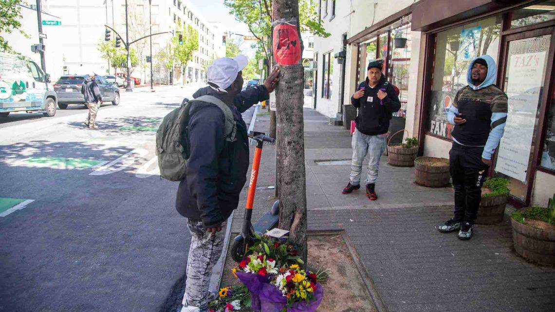 A makeshift memorial for Mark Garrity Jr. stands outside Taz’s convenience store in downtown Raleigh Tuesday, April 11, 2023. Garrity Jr. who lived in Cary, was hospitalized and died two days later from wounds he sustained after an alleged altercation with Taiseer “Taz” Zarka, the store’s owner on Thursday.