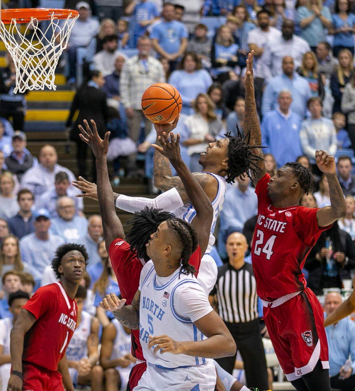 North Carolina’s Caleb Love (2) drives to the basket for two of his 16 points in the second half against N.C. State on Saturday, January 21, 2023 at the Smith Center in Chapel Hill, N.C.
