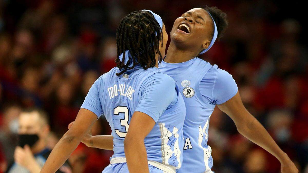 North Carolina guard Kennedy Todd-Williams (3) and forward Anya Poole, right, celebrate during a women’s college basketball game in the NCAA tournament hosted in Tucson, Ariz., Monday, March 21, 2022. (Rebecca Sasnett/Arizona Daily Star via AP)