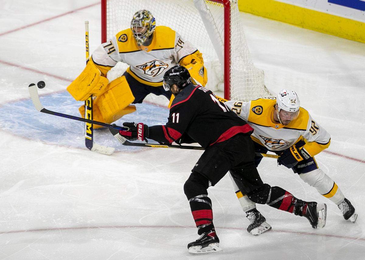 Carolina Hurricanes’ Jordan Staal (11) works the puck to the goal to score in overtime to secure a 3-2 victory over Nashville in game five of their first round Stanley Cup Series on Tuesday, May 25, 2021 at PNC Arena in Raleigh, N.C.
