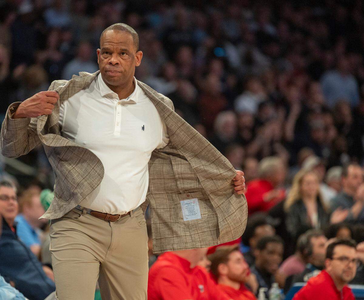 North Carolina coach Hubert Davis removes his coat after an argument with the officials following a technical foul on Armando Bacot (5) during the first half against Connecticut in the Jimmy V Classic on Tuesday, December 5, 2023 at Madison Square Garden in New York, NY.
