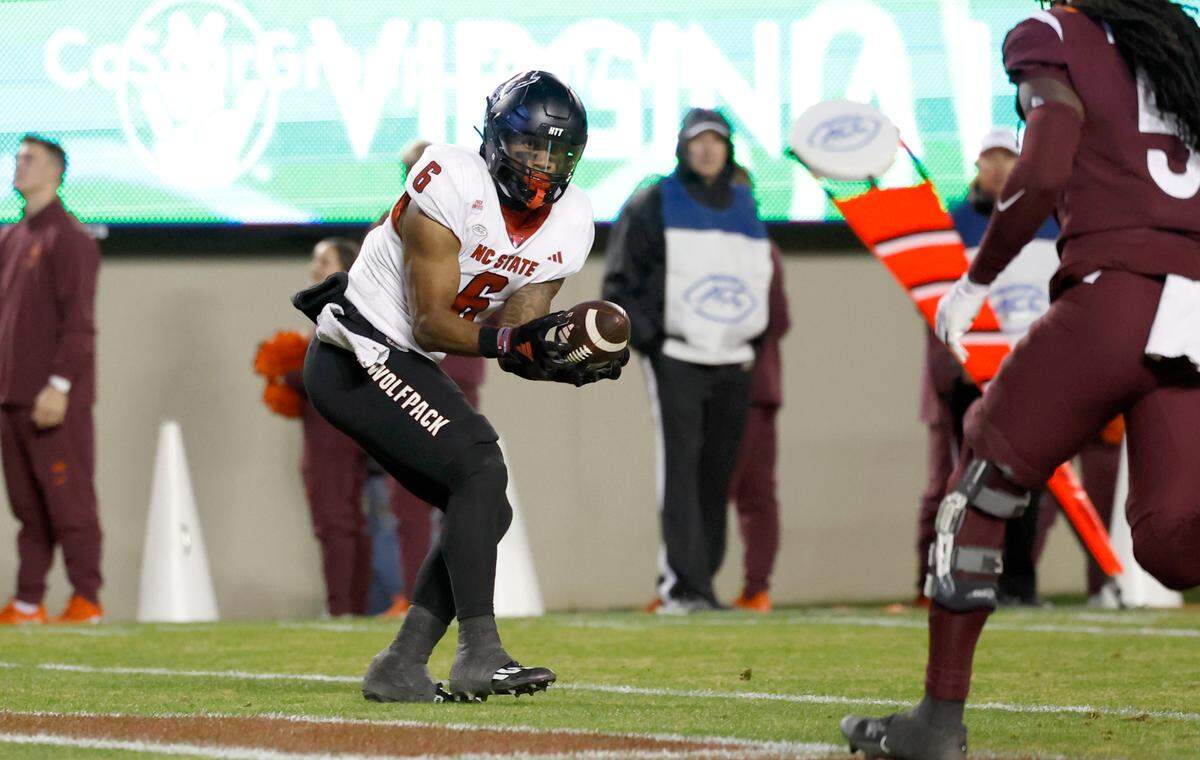 N.C. State’s Trent Pennix (6) catches a 17-yard touchdown reception thrown by KC Concepcion during the second half of N.C. State’s 35-28 victory over Virginia Tech at Lane Stadium in Blacksburg, VA, Saturday, Nov. 18, 2023.