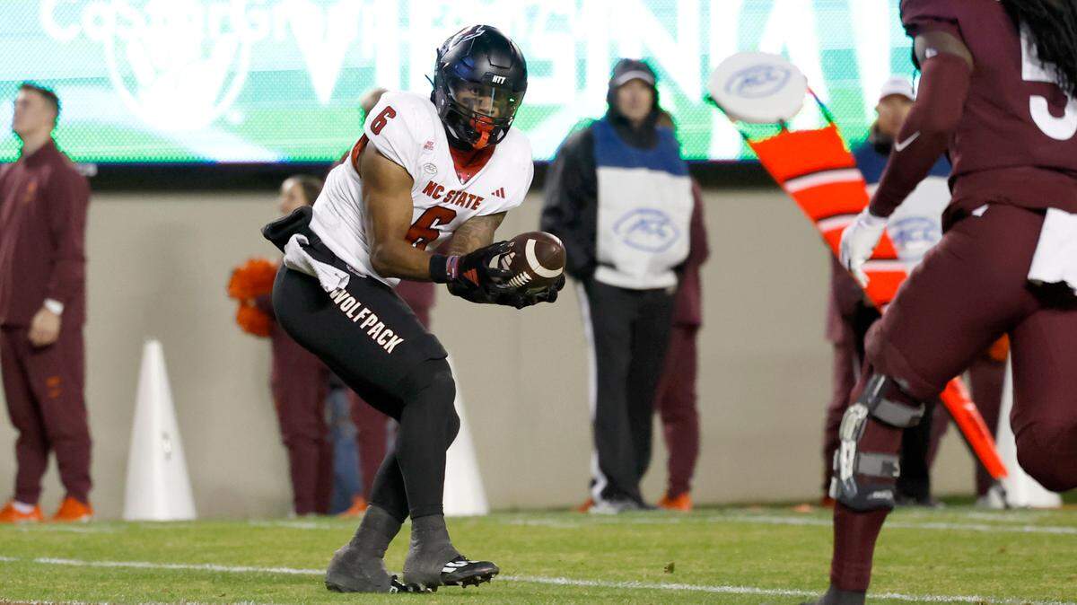 N.C. State’s Trent Pennix (6) catches a 17-yard touchdown reception thrown by KC Concepcion during the second half of N.C. State’s 35-28 victory over Virginia Tech at Lane Stadium in Blacksburg, VA, Saturday, Nov. 18, 2023.