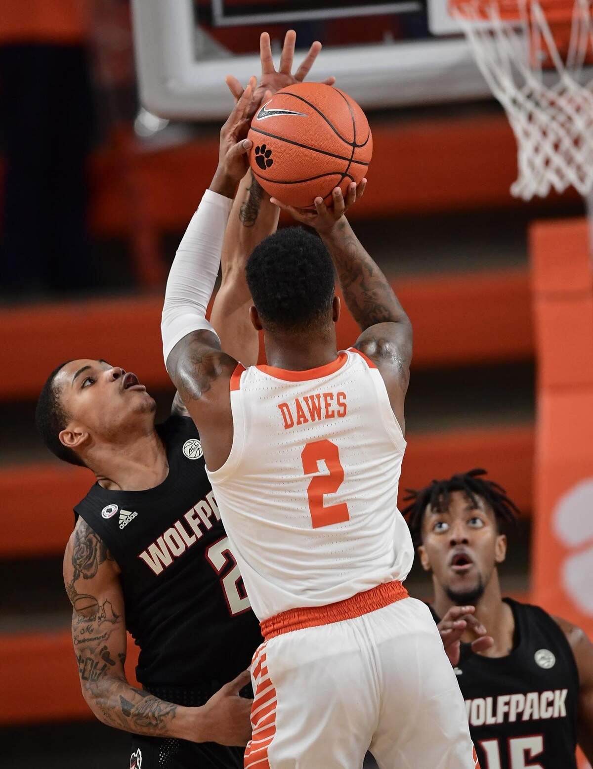 NC State guard Shakeel Moore(2) defends Clemson sophomore guard Al-Amir Dawes(2) during the first half of their game Jan. 5, 2021.