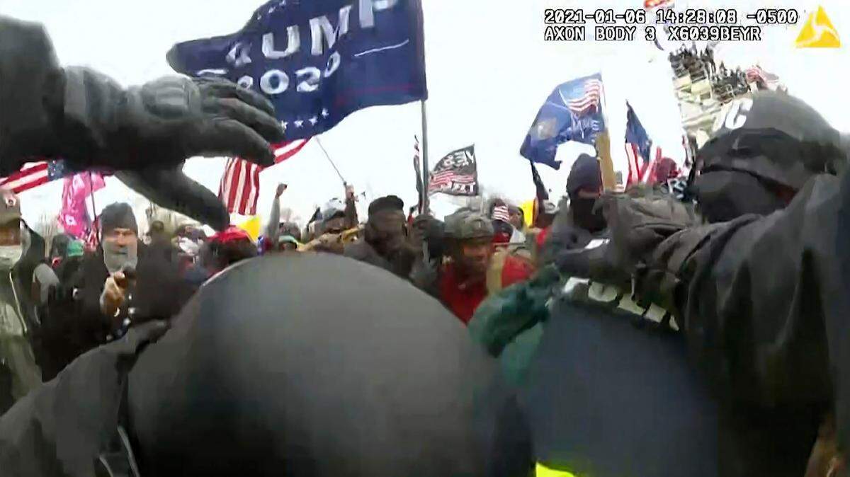 This image from video from a police worn body camera from the Jan. 6 riot at the U.S. Capitol, was played as a committee exhibit as the House select committee investigating the the Jan. 6 attack on the U.S. Capitol, held a hearing Thursday, June 9, 2022, on Capitol Hill in Washington. (House Select Committee via AP)