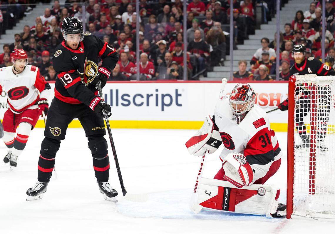 Drake Batherson of the Ottawa Senators battles for position as goalie Frederik Andersen of the Carolina Hurricanes makes a save during the second period in Game 3 of the first round of the 2026 Stanley Cup playoffs at Canadian Tire Centre on April 23, 2026, in Ottawa, Canada.