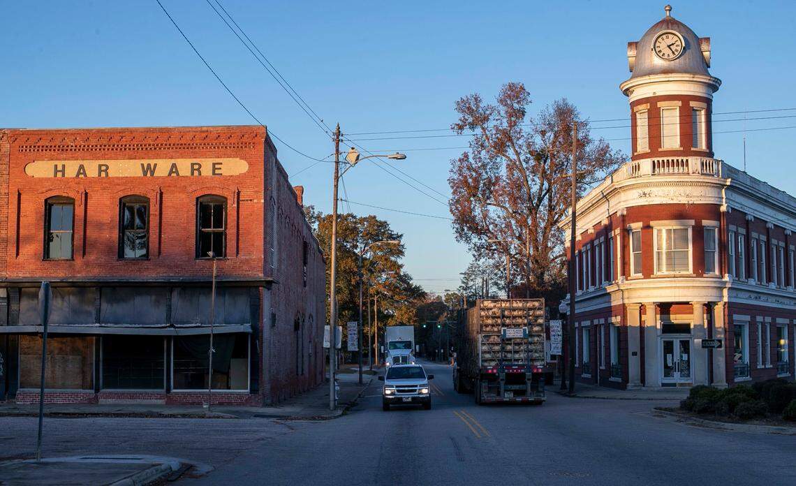 The Maxton Town Hall, right and the Hardware Store, left, on Patterson Street in the heart of Maxton N.C. on Tuesday, November 30, 2021.