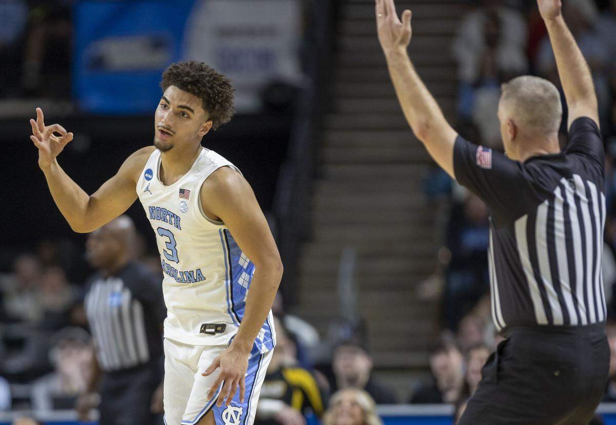 North Carolina guard Derek Dixon (3) reacts after sinking a three-point basket against VCU in the first half on Thursday, March 18, 2026, during the first round of the NCAA Tournament at Bon Secours Arena in Greenville, S.C.