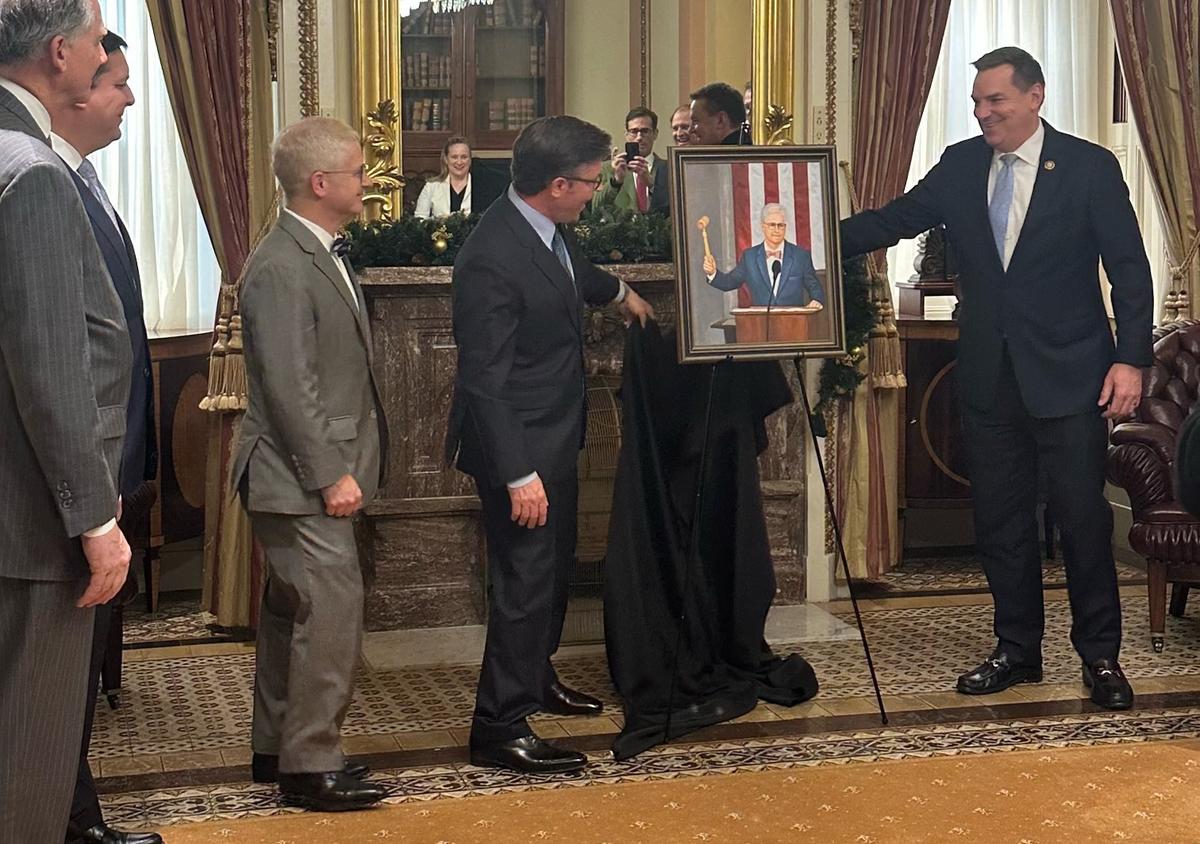 Rep. Richard Hudson unveils the “small” portrait he had painted of Rep. Patrick McHenry to honor his work as House speaker pro-tem.