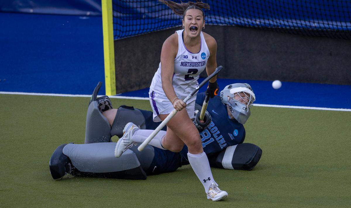 Northwestern’s Lauren Wadas (2) scores on North Carolina goalie Maddie Kahn (81) in the sudden death shootout during the NCAA Division I Field Hockey Championship on Sunday, November 19, 2023 at Karen Shelton Stadium in Chapel Hill, N.C.