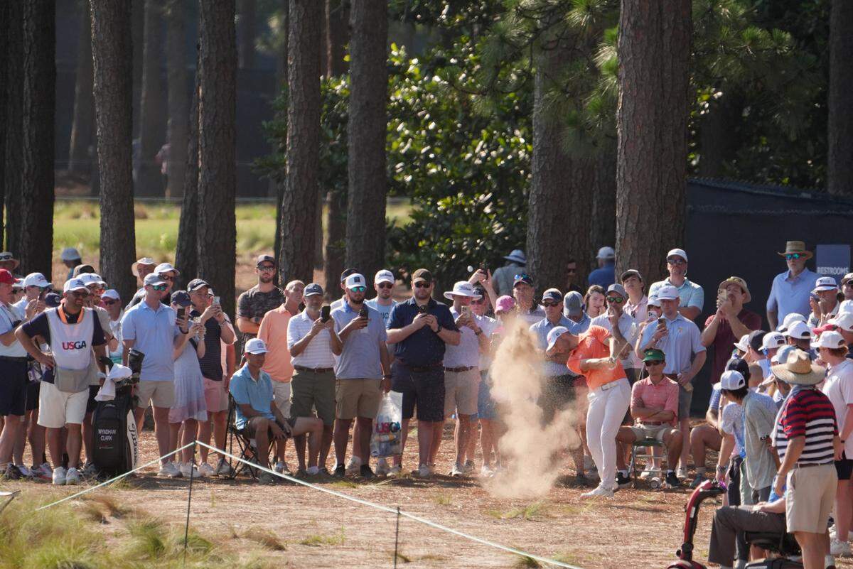Defending champion Wyndham Clark hits out of the waste area on the 13th hole during the second round of the U.S. Open golf tournament at Pinehurst No. 2.