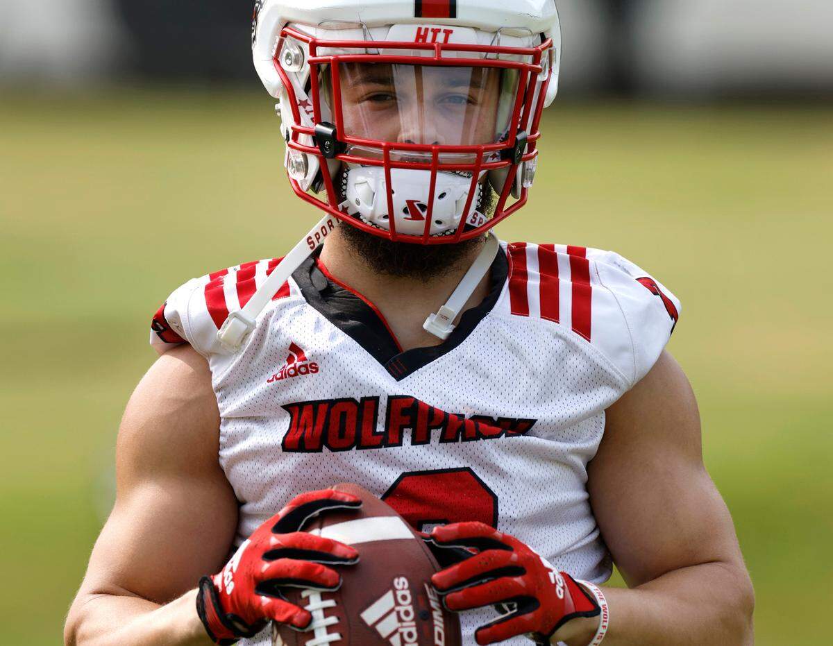 N.C. State running back Jordan Houston (3) waits for a drill to start during the Wolfpack’s first fall practice in Raleigh, N.C., Wednesday, August 2, 2023.