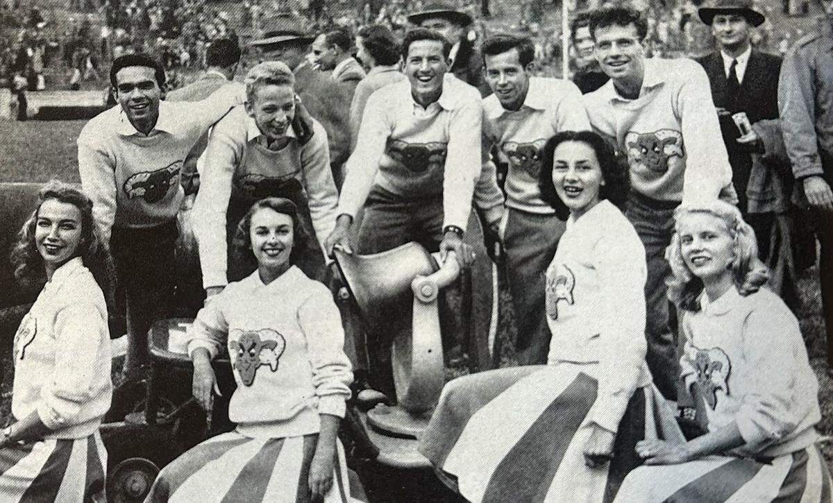 Norm Sper and the North Carolina cheerleading squad with the original Carolina-Duke victory bell, following a 20-0 victory at Kenan Stadium in 1948. Image from the University of North Carolina yearbook, the Yackety-Yack.