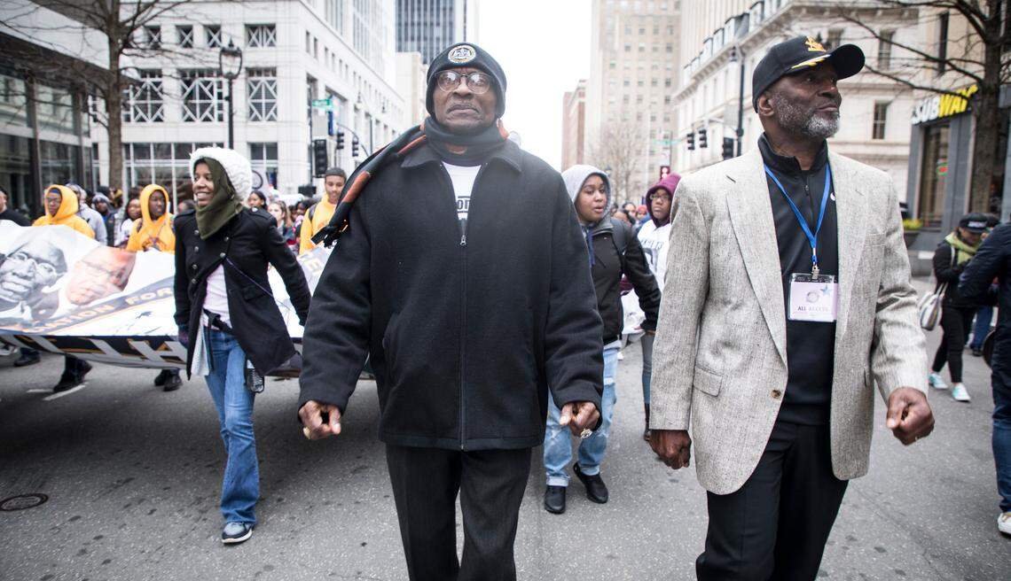 North Carolina NAACP President Rev. Dr. T. Anthony Spearman, center, marches towards the stage during the annual Moral March on Raleigh on Saturday, Feb. 9, 2019.
