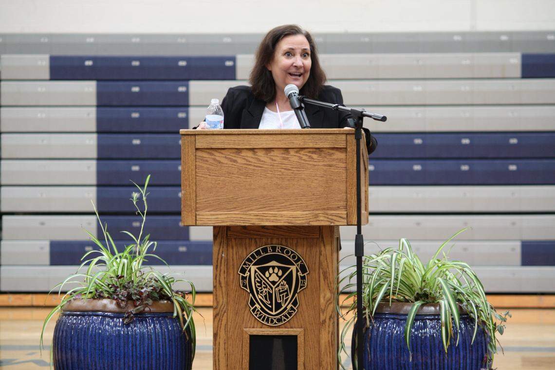 Dana King speaks at a surprise ceremony honoring her at Millbrook High School in Raleigh, N.C., on March 28, 2022. King died on April 2 just weeks before she was to retire on April 29 as the school’s principal.