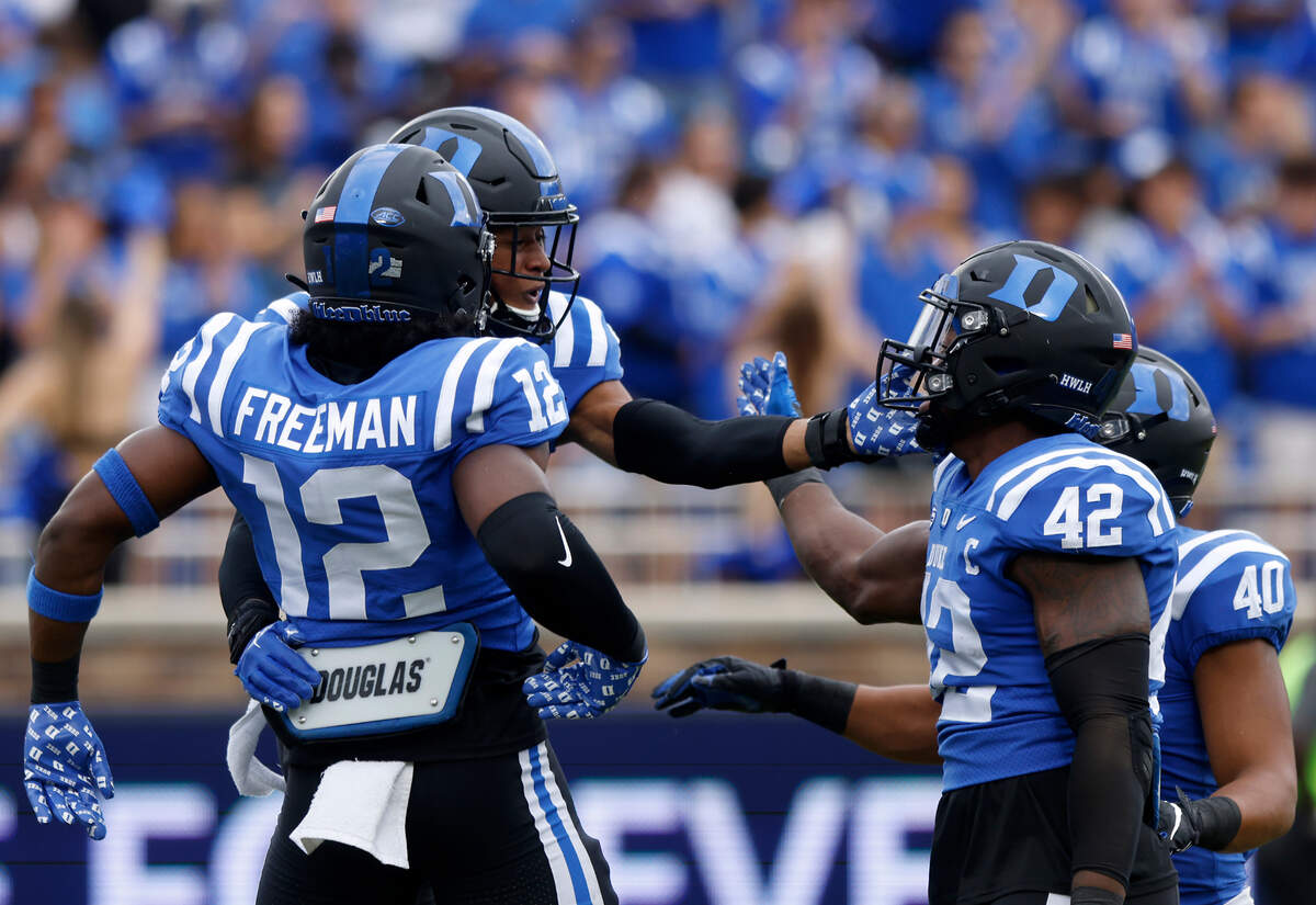 From left, Duke’s Tre Freeman, Brandon Johnson, Shaka Heyward and Ryan Smith celebrate after a defensive stop during the first half of the Blue Devils’ game against Virginia Tech at Wallace Wade Stadium on Saturday, Nov. 12, 2022, in Durham, N.C.
