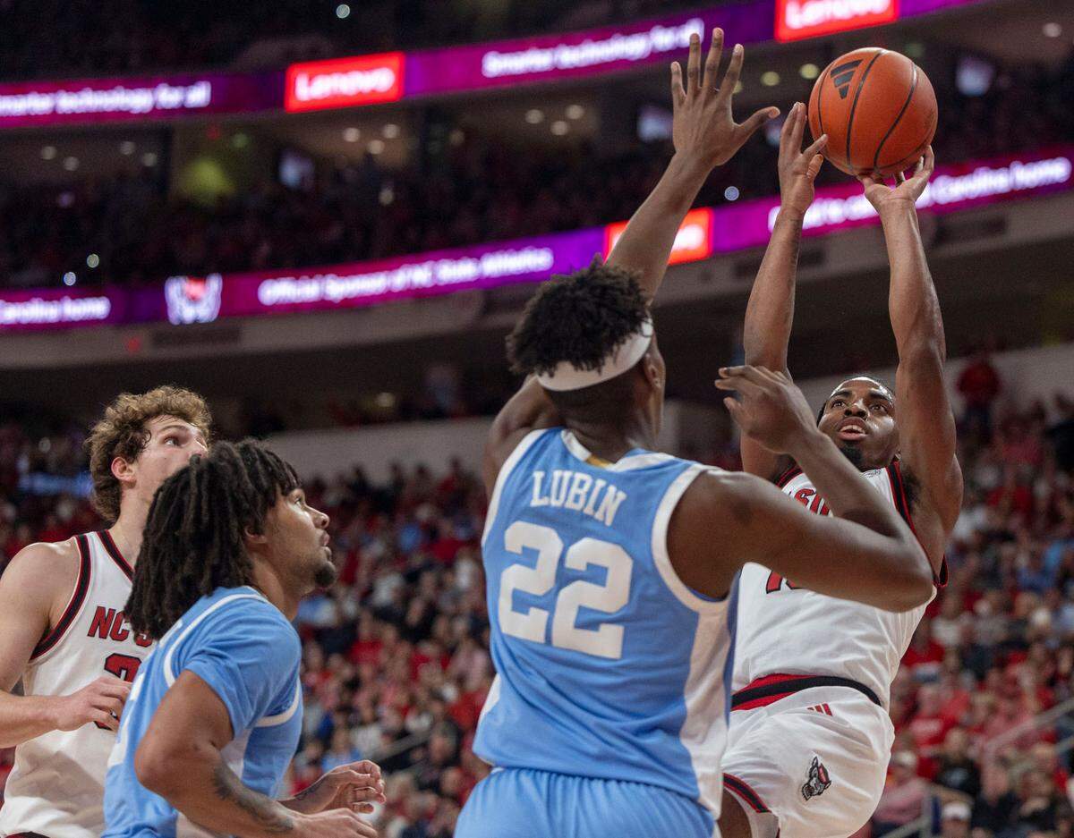 N.C. State guard Marcus Hill Jr. (10) puts up a shot against North Carolina forward Ven-Allen Lubin (22) in the first half on Saturday, January 11, 2025 at Lenovo Center in Raleigh, N.C. Hill Jr. lead N.C. State with 20 points in their 63-61 loss to North Carolina.