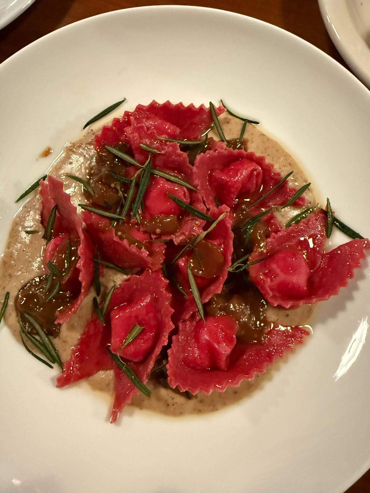 Vivid folds of cappellacci pasta, stuffed with gorgonzola and tossed in a walnut sauce with fried rosemary at the Raleigh Italian restaurant Figulina.