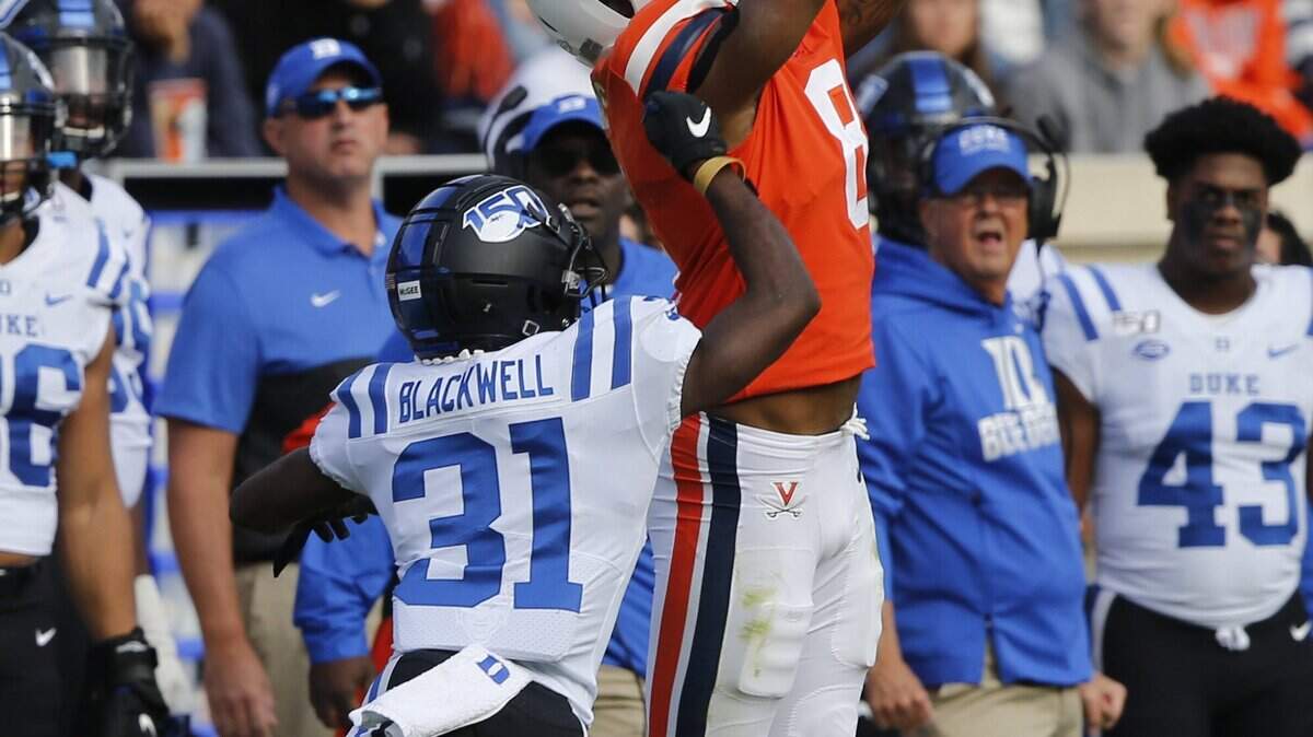 Virginia wide receiver Hasise Dubois (8) goes up for a pass as Duke cornerback Josh Blackwell (31) defends during the first half of an NCAA college football game in Charlottesville, Va., Saturday, Oct. 19, 2019.