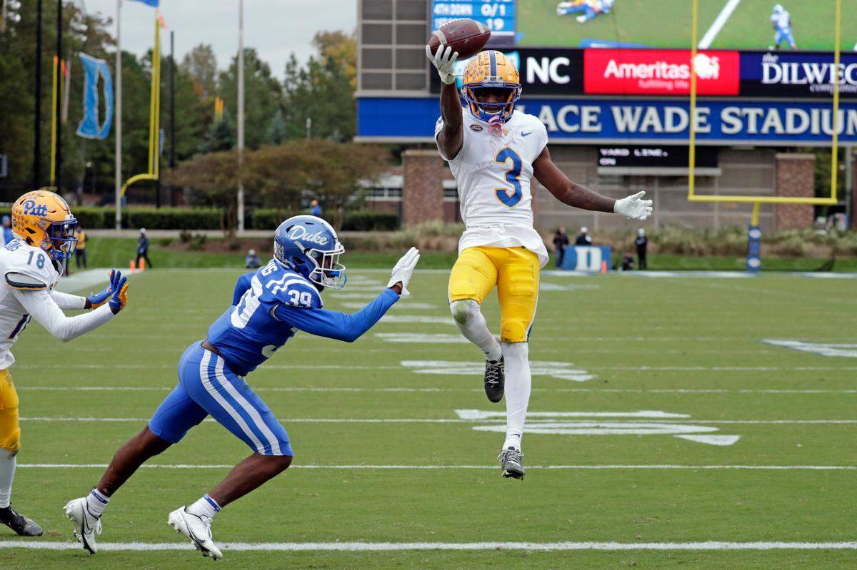 Pittsburgh wide receiver Jordan Addison (3) leaps into the end zone past Duke cornerback Jeremiah Lewis (39) for a touchdown during the second half of an NCAA college football game Saturday, Nov. 6, 2021, in Durham, N.C. (AP Photo/Chris Seward)