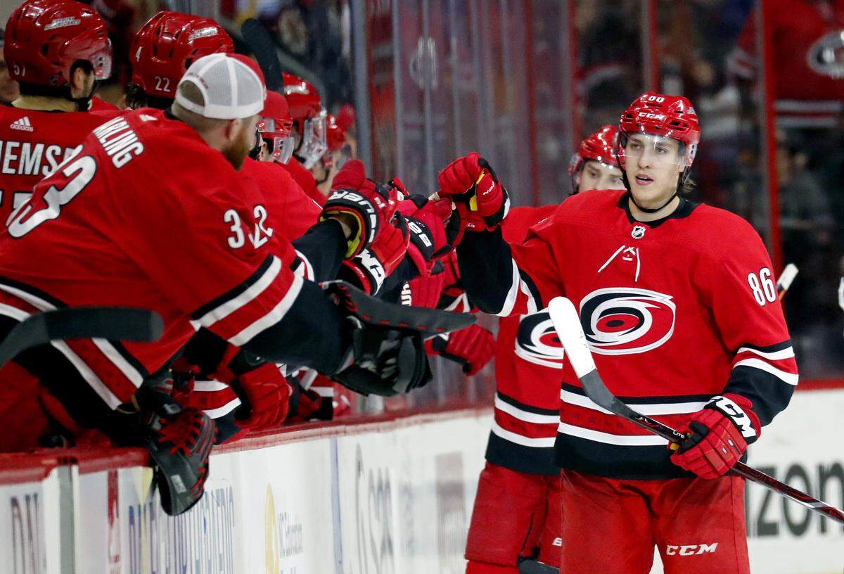 The Canes' Teuvo Teravainen (86) celebrates after he scored a power play goal during the second period of an NHL game played between the Carolina Hurricanes and the Boston Bruins at PNC Arena in Raleigh on Tuesday, March 13, 2018.