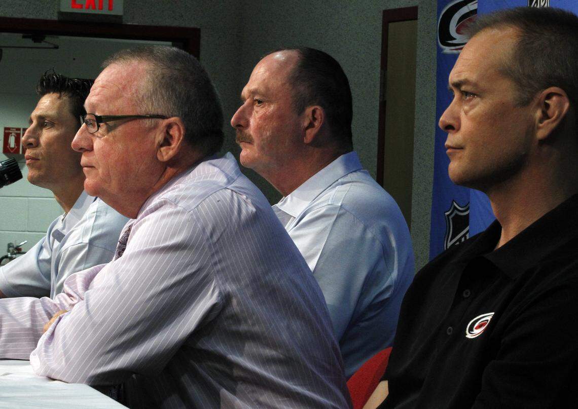 Jim Rutherford, President and General Manager of Carolina Hurricanes (second from left), today announced that Dave Lewis (second from right) and Rod Brind’Amour (at left) have each been named to the team’s coaching staff for the 2011-12 season. Sitting in during the announcement was head coach Paul Maurice (right).