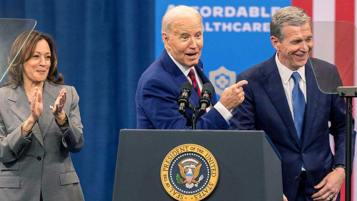 Vice President Kamala Harris, President Joe Biden and Gov. Roy Cooper join each other on stage after speeches on heath care during a campaign stop at the Chavis Community Center in Raleigh on Tuesday, March 26, 2024.