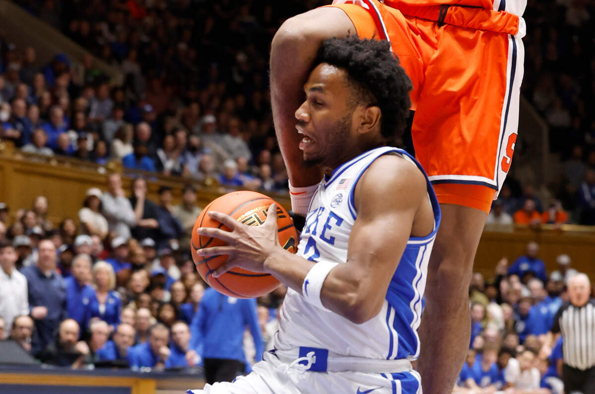 Duke’s Jeremy Roach (3) is fouled by Syracuse’s Chris Bell (4) during the first half of Duke’s game against Syracuse at Cameron Indoor Stadium in Durham, N.C., Tuesday, Jan. 2, 2024.